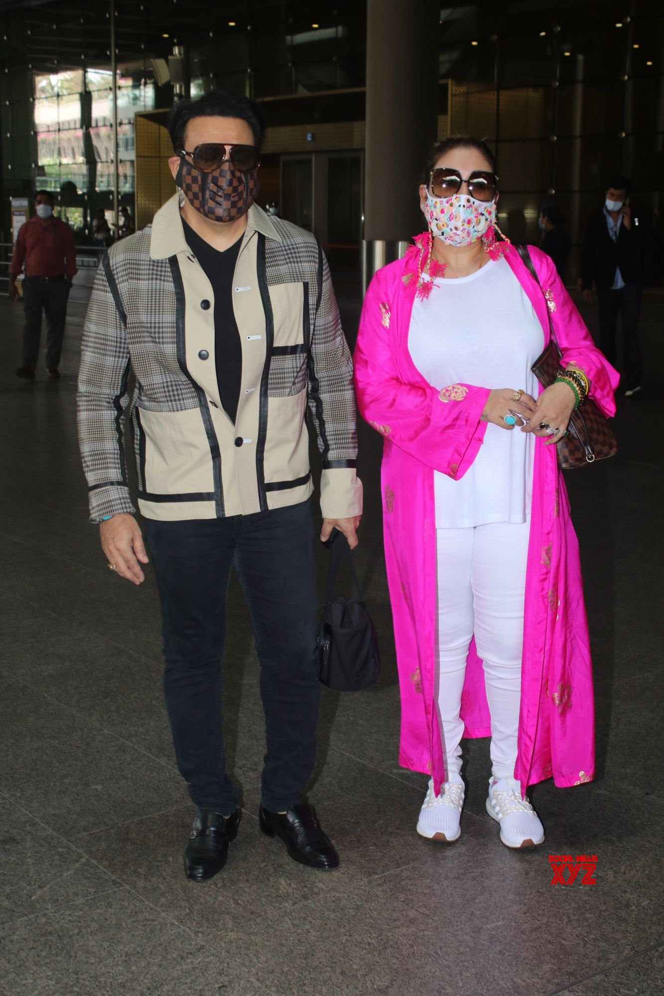 Govinda And Wife Sunita Ahuja Spotted At Airport Departure Gallery