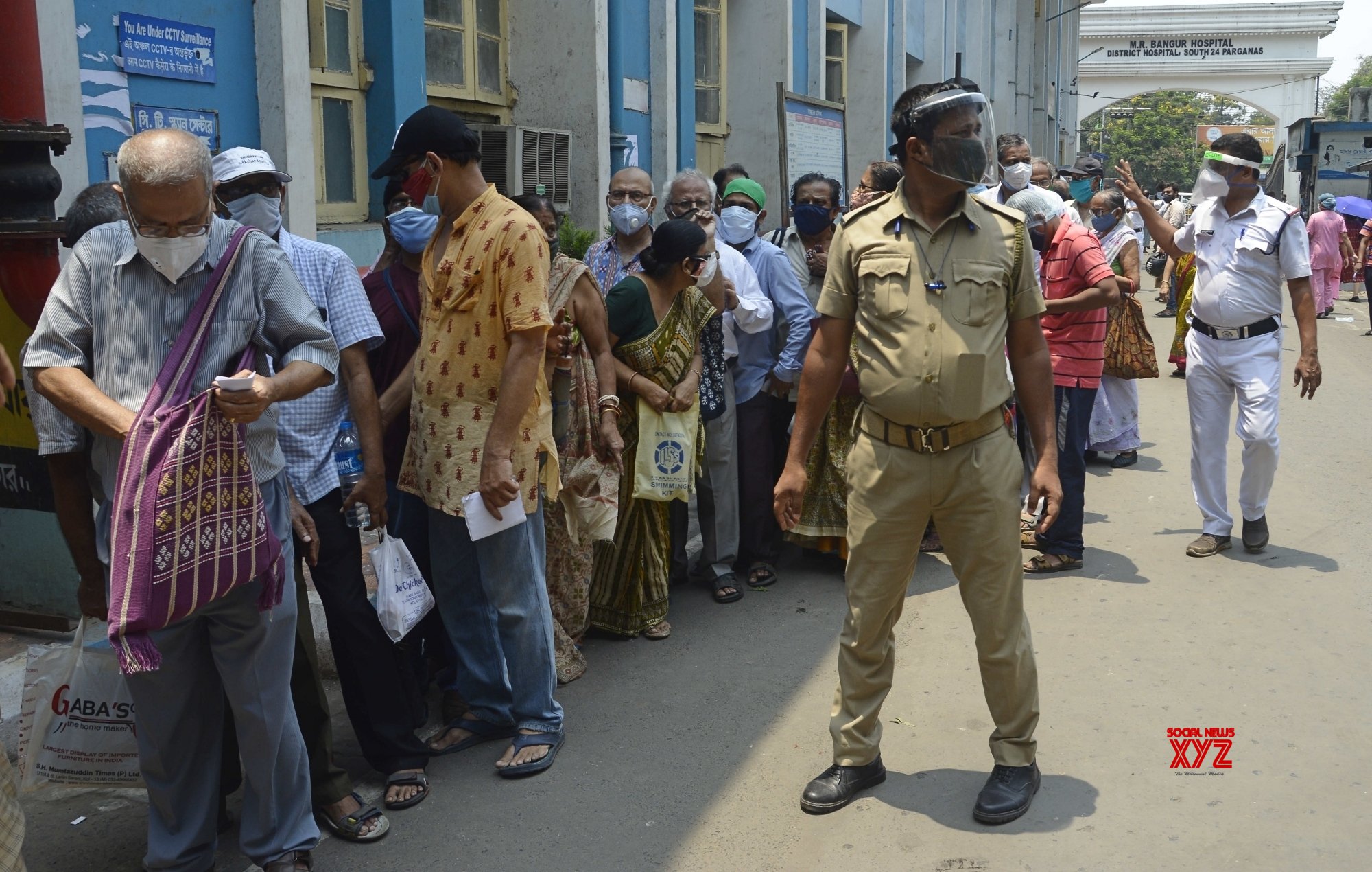 Kolkata :People Stand In A Queue At A M R Bangur Hospital To Receive ...