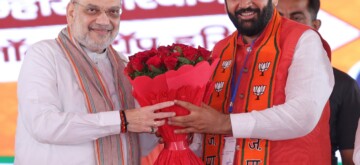 Kurukshetra : Union Home Minister and Senior BJP leader Amit Shah with Haryana Chief Minister Nayab Singh Saini during a public meeting for the Haryana Assembly Elections in Kurukshetra  on Friday, September 27, 2024. (IANS)