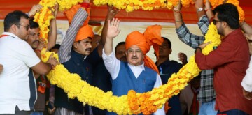 Kathua: BJP National President J P Nadda being garlanded during a public meeting for Jammu and Kashmir Assembly Elections in Kathua district   on Friday, September 27, 2024.(IANS)