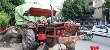 Noida: A damaged tractor involved in a fatal road accident that claimed four lives and left one person injured, after a car collided with it in Sector 24, Noida late Sunday night, seen in Noida on Monday, September 30, 2024. (Photo: IANS)