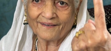 Jammu: An 83-year-old woman, Krishna Devi, shows her inked finger after casting her vote in Jammu on Tuesday, October 01, 2024. (Photo: IANS)