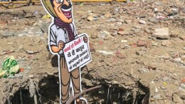 New Delhi: A cut-out of Aam Aadmi Party (AAP) Supremo Arvind Kejriwal is placed at a pothole during a Delhi BJP protest against poor road conditions at Chandni Chowk in New Delhi on Wednesday, October 3, 2024. (Photo: IANS)