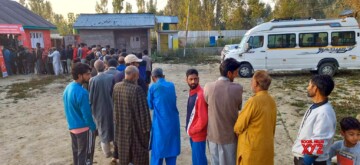 Baramulla: Voters line up at a polling booth during the third phase of Jammu and Kashmir Assembly Elections in Baramulla on Tuesday, October 01, 2024. (Photo: IANS)