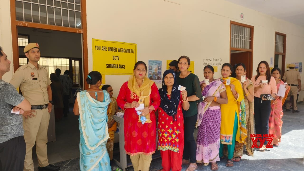 Faridabad: Voters stand in a queue to cast their votes in the Haryana Assembly elections #Gallery