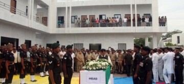 Rajkot: Union Minister Mansukh Mandaviya pays his last respect to Gunner Gohil Vishvarajsinh from the Artillery Centre Hyderabad died during a field firing exercise at the Deolali Field Firing Ranges in Nashik district, Rajkot on Friday, October 11, 2024. (Photo: IANS)