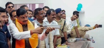 Ujjain: Madhya Pradesh Chief Minister Mohan Yadav takes aim with a gun at the inauguration of the Rajmata Vijayaraje Scindia Multipurpose Sports Complex in Ujjain on Friday, November 01, 2024. (Photo: IANS)