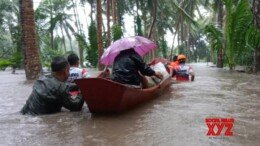 (241023) -- ALBAY PROVINCE, Oct. 23, 2024 (Xinhua) -- Rescuers relocate residents in province of Albay, the Philippines, on Oct. 22, 2024. Flash floods have hit several regions in the Philippines as Tropical storm Trami brought heavy rains and plunged many areas without power, affecting over 380,000 people, authorities said Wednesday. (Philippine Army/Handout via Xinhua)