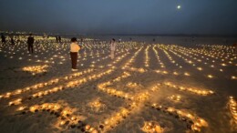 Varanasi: Devotees light earthen lamps (diyas) on the ghats , marking the auspicious occasion of Sharad Purnima and Dev Deepawali in Varanasi on Friday, November 15, 2024. (Photo: IANS)